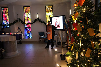 Photograph of the college chaplain delivering a liturgy service in the chapel