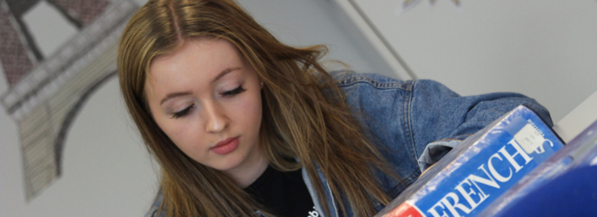 Photograph of a student studying French