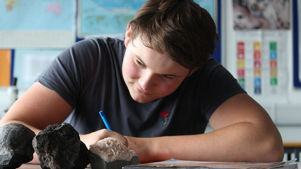 Photograph of a student revising for a Geology exam